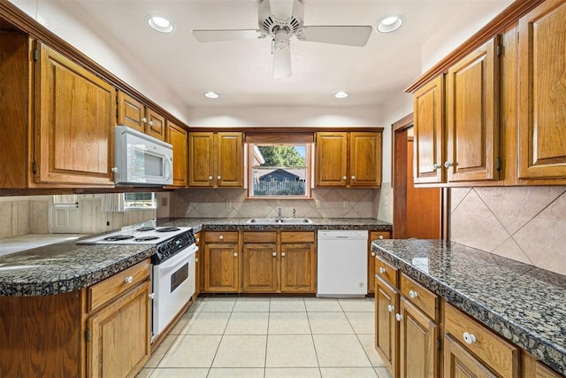 kitchen featuring backsplash, white appliances, ceiling fan, sink, and light tile patterned floors