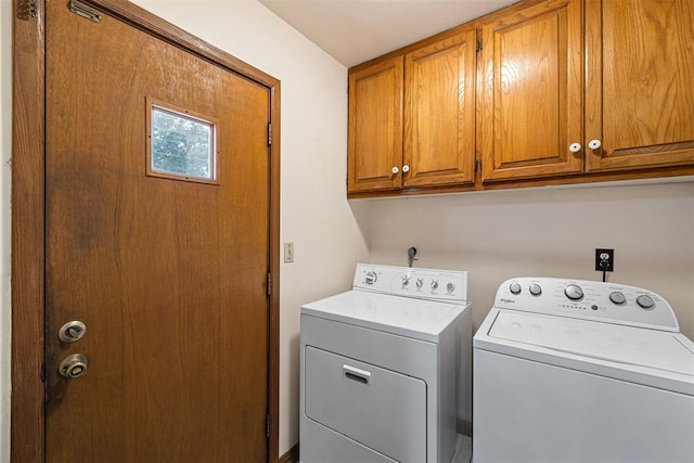 laundry area with cabinets and washing machine and dryer