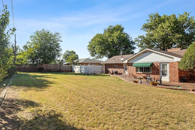 view of yard with a patio area and central AC unit