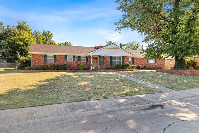 ranch-style home with a front yard