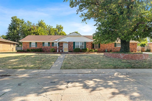 ranch-style house with a front lawn