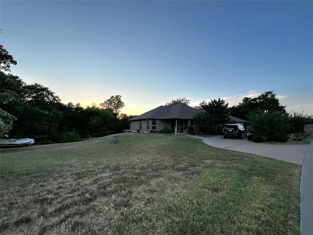 view of front of house with a yard