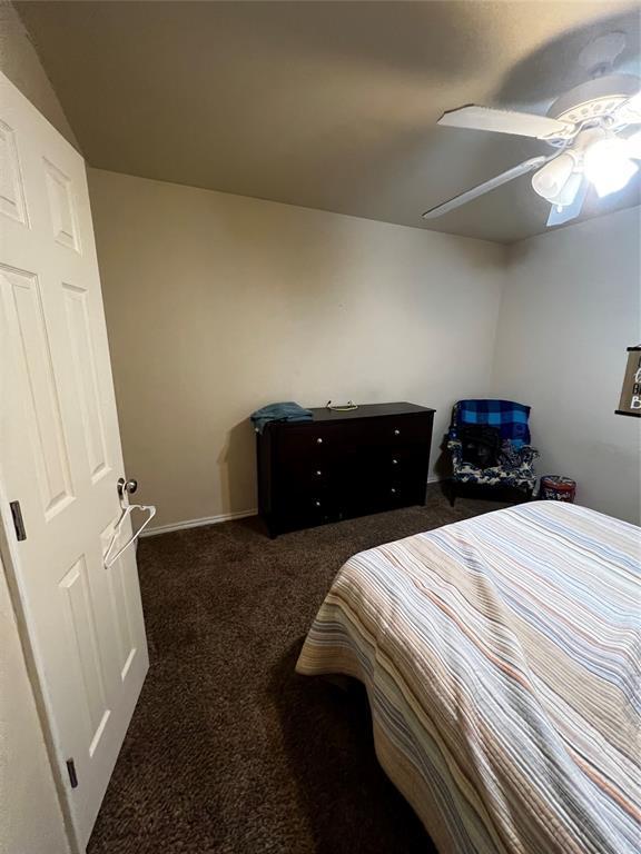 carpeted bedroom featuring ceiling fan