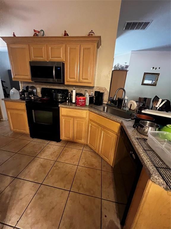 kitchen featuring sink, light tile patterned floors, black appliances, and ornamental molding