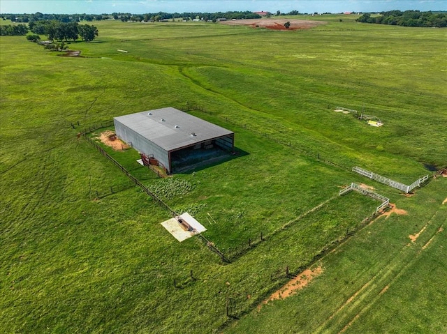 birds eye view of property with a rural view