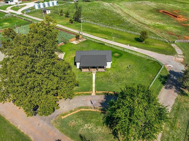 birds eye view of property with a rural view