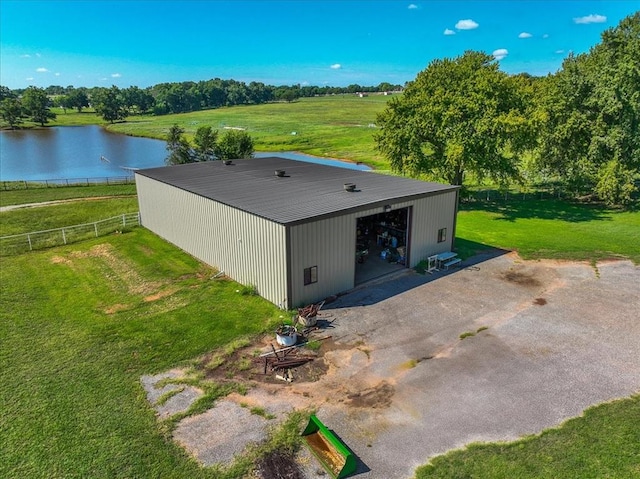 drone / aerial view featuring a water view and a rural view