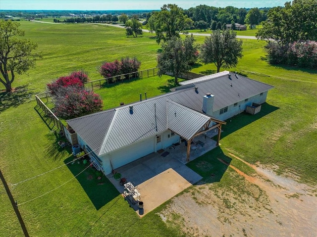 birds eye view of property with a rural view