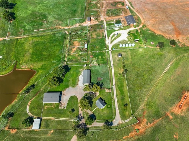 drone / aerial view featuring a water view and a rural view