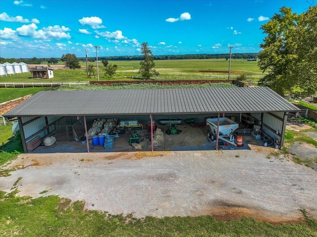 view of car parking featuring a rural view