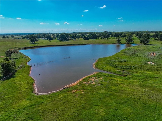 birds eye view of property with a rural view and a water view