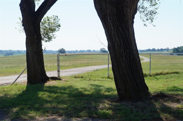 view of yard with a rural view