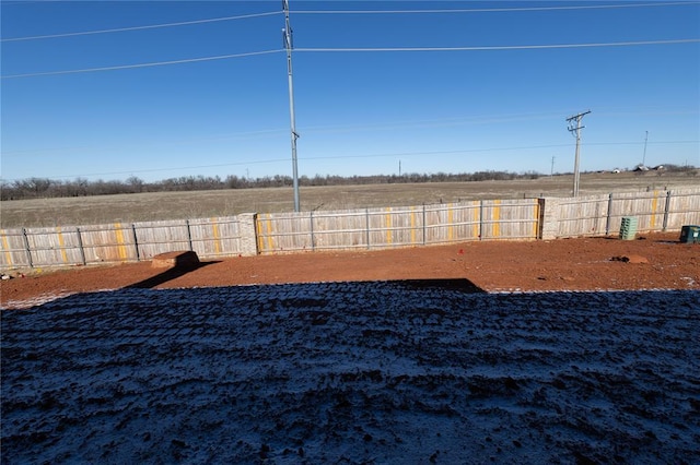 view of yard with a rural view