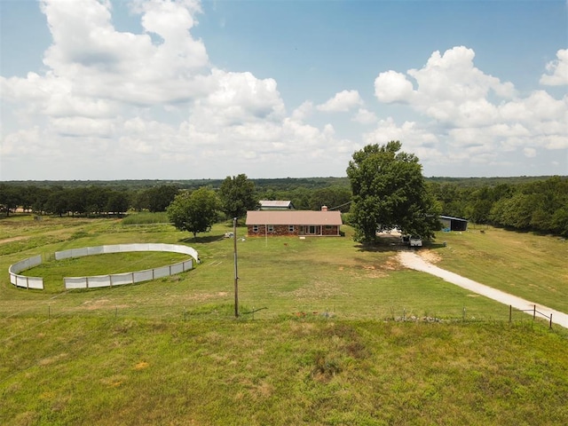 view of home's community with a lawn and a rural view