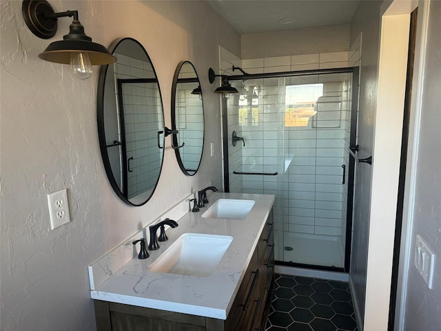 bathroom featuring vanity, tile patterned floors, and walk in shower