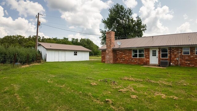 view of yard with central AC