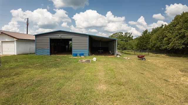 view of outdoor structure featuring a yard