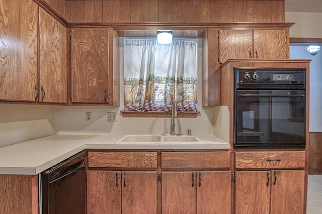 kitchen featuring black appliances and sink