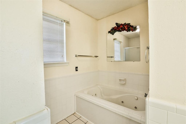 bathroom featuring tile patterned floors and a bathtub