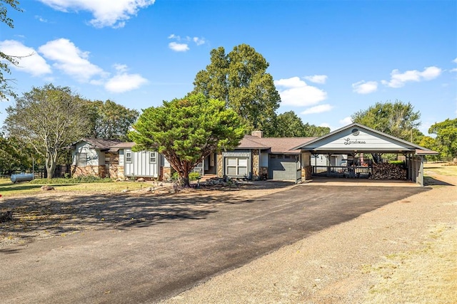 ranch-style house featuring a carport