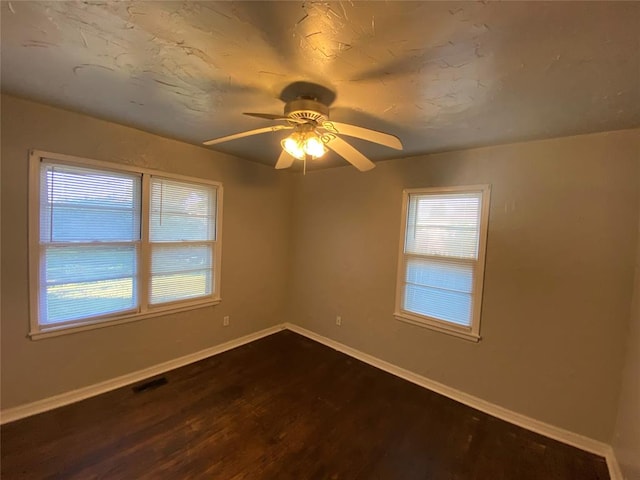 unfurnished room featuring ceiling fan and hardwood / wood-style floors