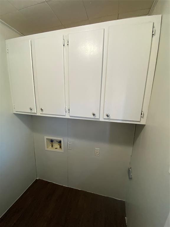 laundry area with cabinets, hookup for a washing machine, and dark hardwood / wood-style flooring