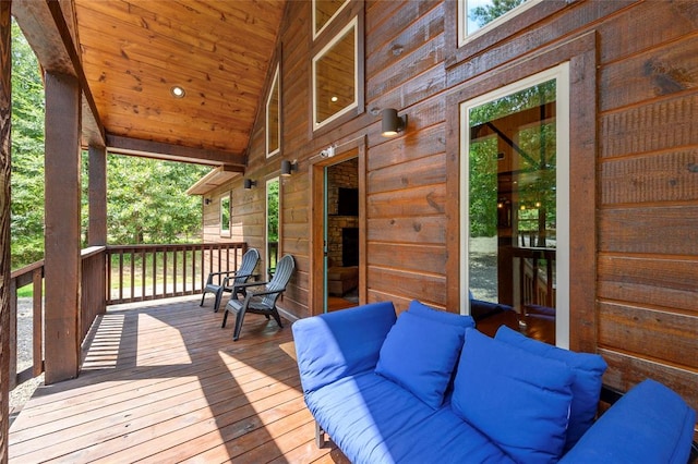 wooden deck featuring an outdoor hangout area