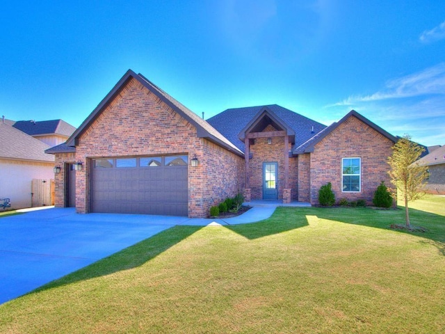 view of front of house with a front yard and a garage