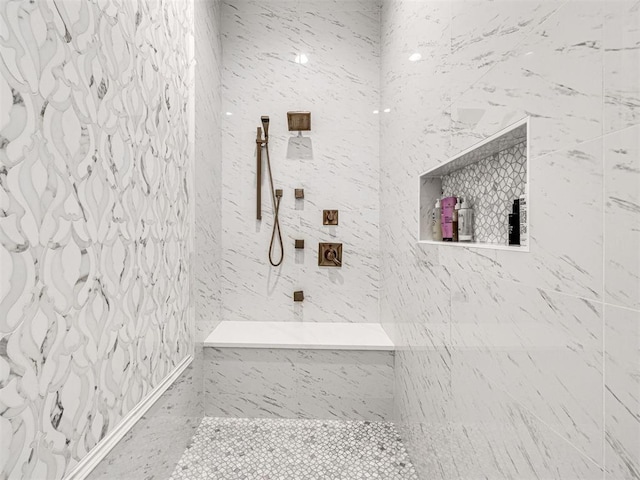 bathroom with tiled shower