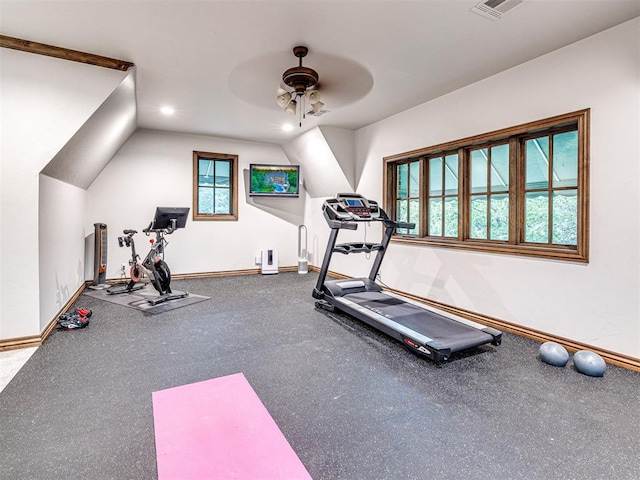 exercise room featuring vaulted ceiling and ceiling fan