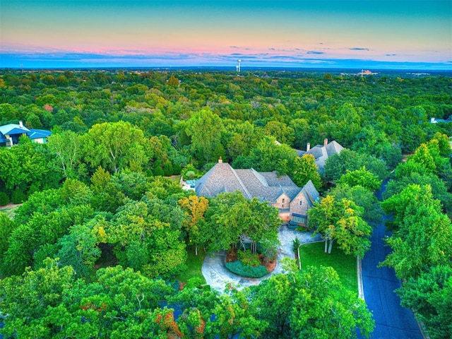 aerial view at dusk with a water view