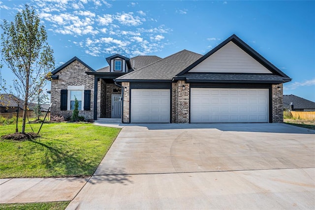 view of front facade featuring a garage and a front yard