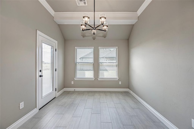 interior space featuring ornamental molding, vaulted ceiling, light hardwood / wood-style flooring, and a notable chandelier