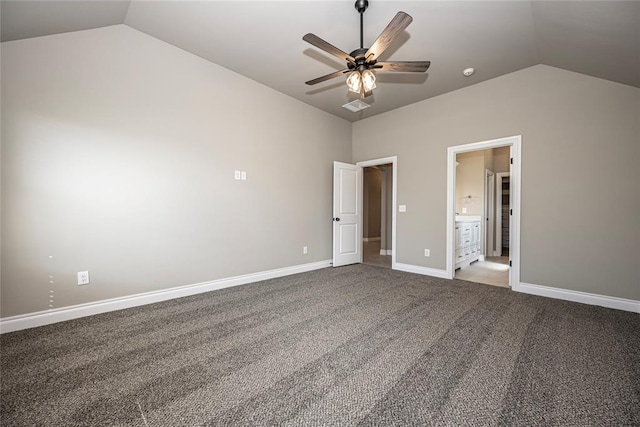 unfurnished bedroom with connected bathroom, ceiling fan, carpet floors, and vaulted ceiling