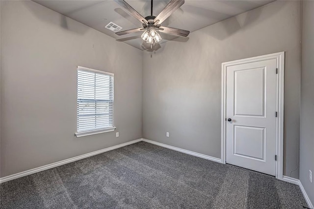 carpeted empty room featuring ceiling fan