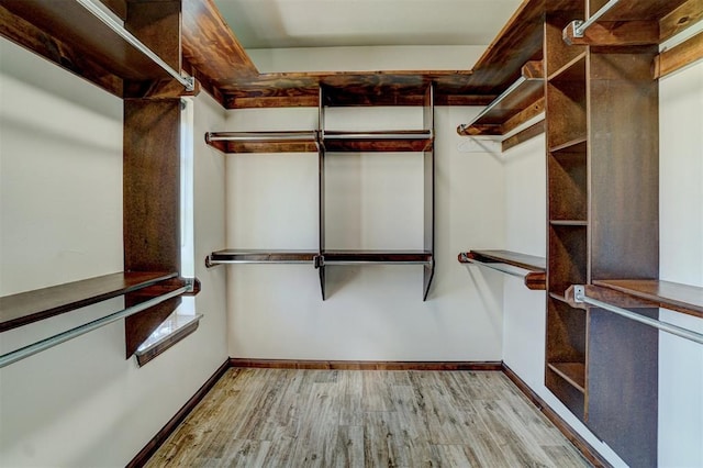 walk in closet featuring light wood-type flooring