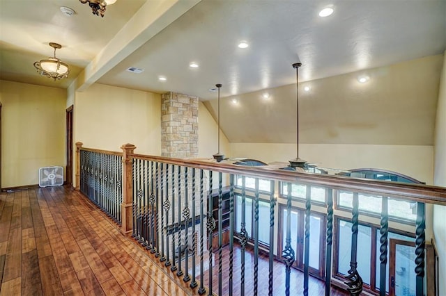 hall featuring hardwood / wood-style floors and lofted ceiling