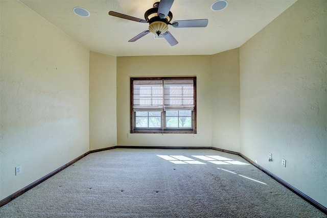 carpeted empty room with ceiling fan