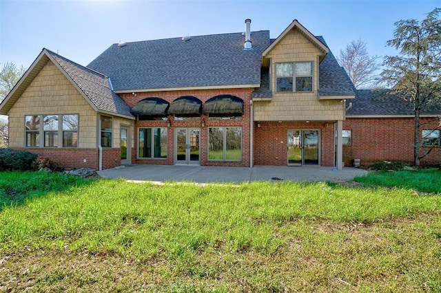 rear view of property with a patio area and french doors