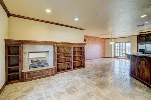 unfurnished living room featuring crown molding