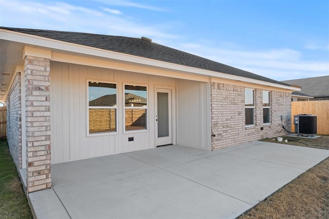 back of property with a patio and cooling unit