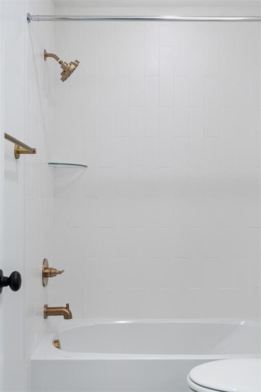 bathroom with shower / tub combination and toilet