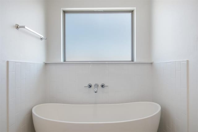 bathroom featuring a tub