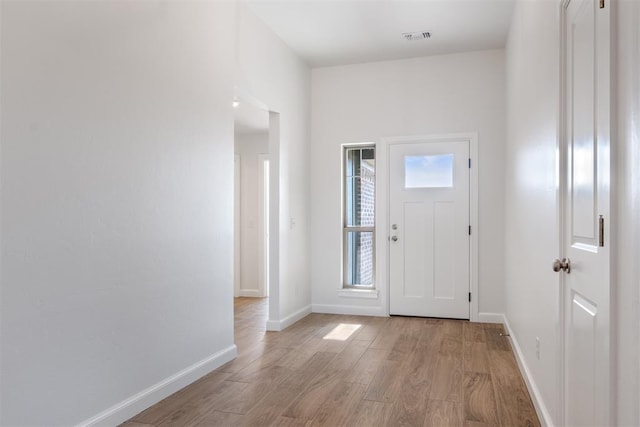 entryway with light hardwood / wood-style floors