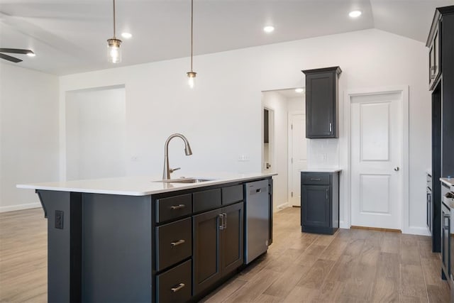 kitchen featuring ceiling fan, dishwasher, sink, an island with sink, and pendant lighting