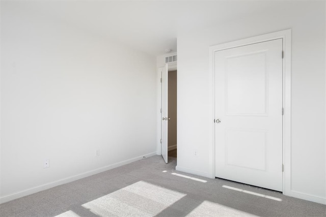 unfurnished bedroom with light carpet