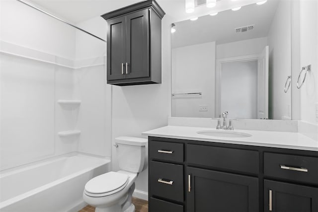 full bathroom featuring shower / washtub combination, vanity, and toilet