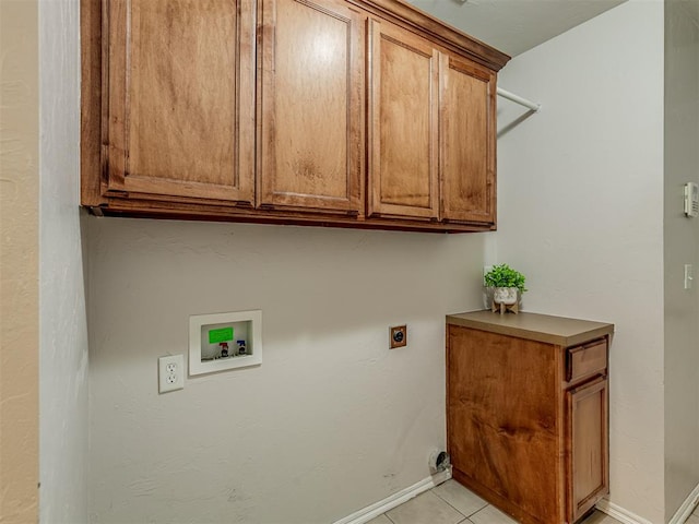 clothes washing area featuring washer hookup, light tile patterned floors, cabinets, and hookup for an electric dryer