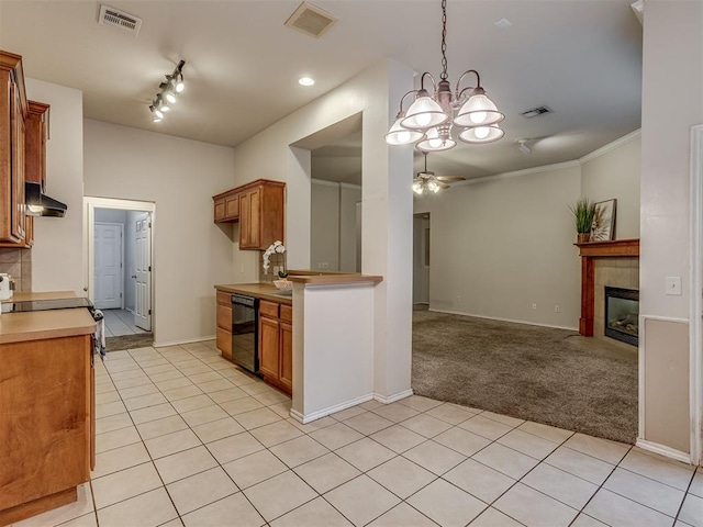 kitchen featuring ceiling fan with notable chandelier, ornamental molding, a fireplace, black dishwasher, and light colored carpet