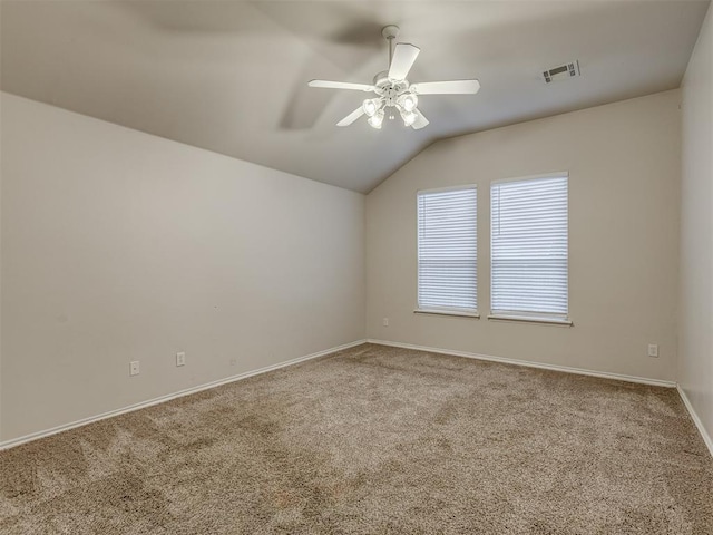 spare room with carpet, ceiling fan, and lofted ceiling